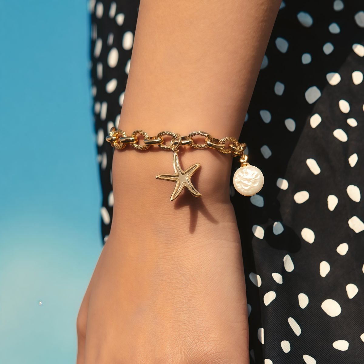 Woman wearing Cosmic Ocean Bracelet with soft beach styling