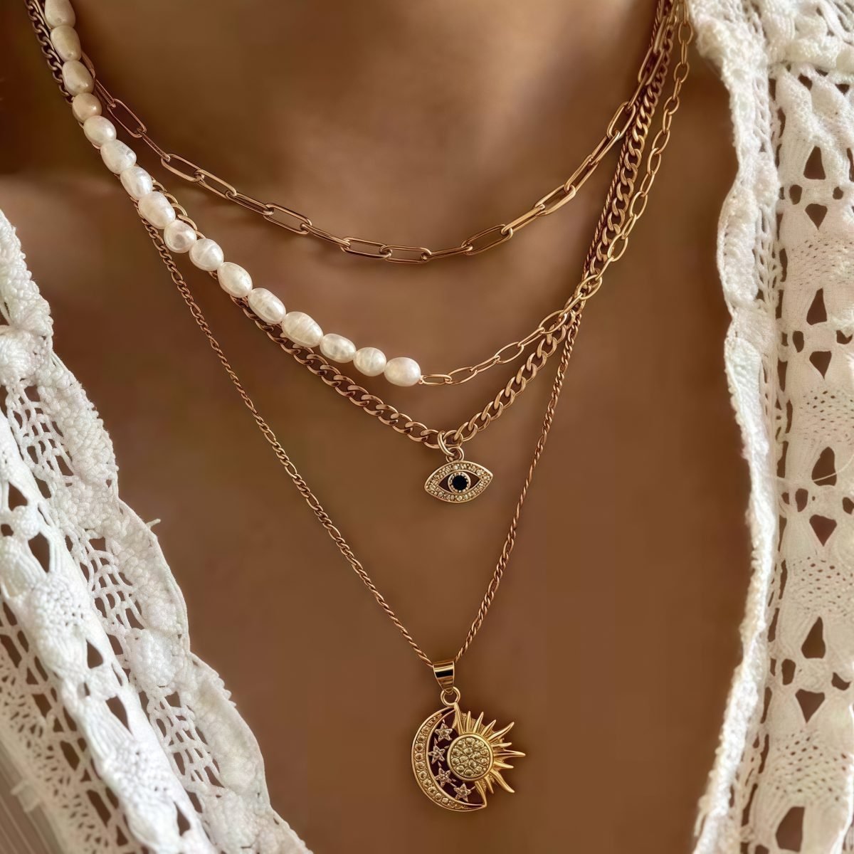 Model wearing the Cosmic Guardian Necklace with layered celestial charms