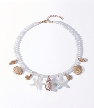Cosmic Tide Pearls Necklace with pearls, shells, and starfish charms on white background