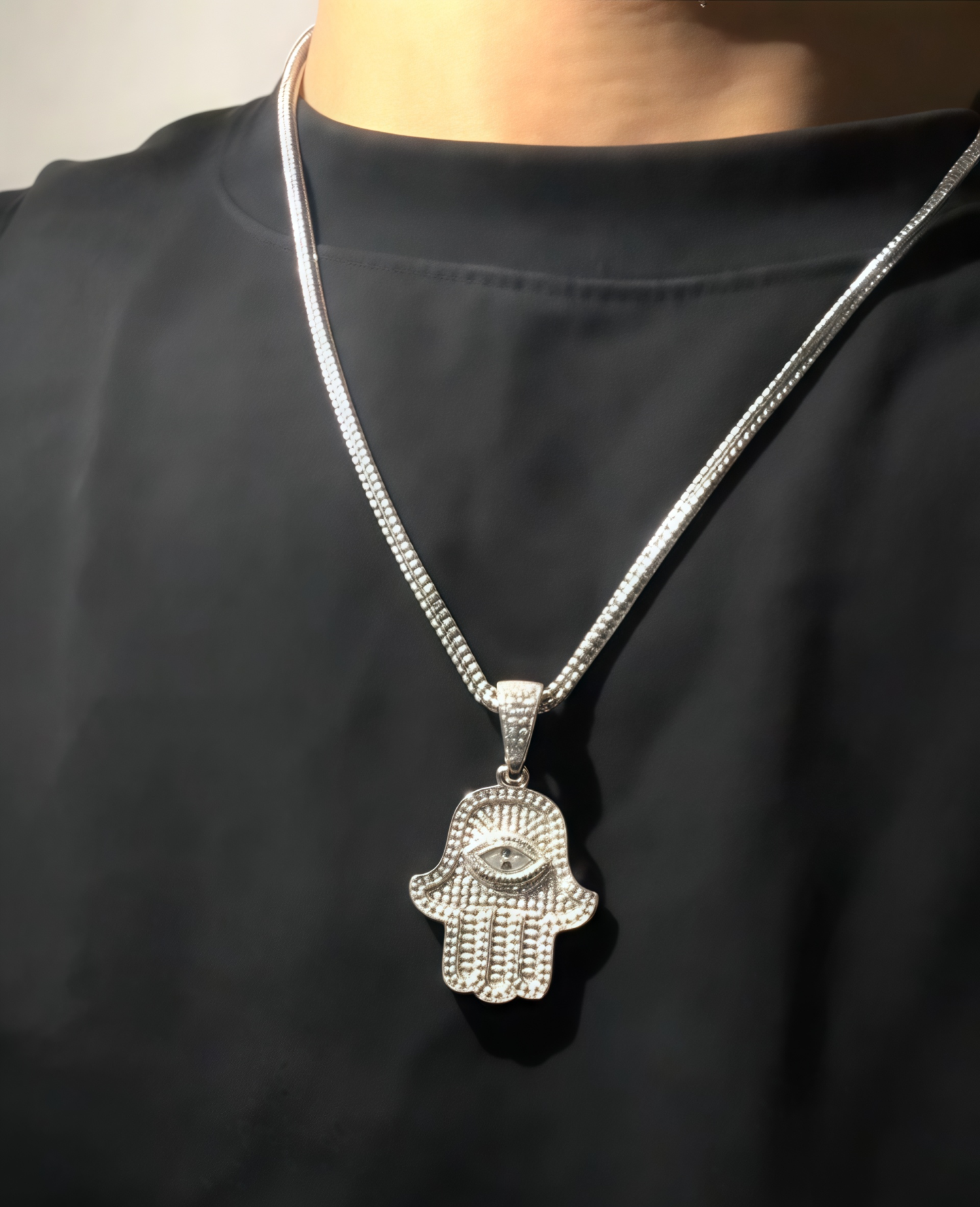 Cosmic Harmony Hamsa Pendant – Micro Zirconia Spark– Front Look Model wearing Cosmic Harmony Hamsa Pendant layered with gold chains