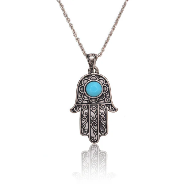 Cosmic Energy Hamsa Necklace with turquoise charm on white background