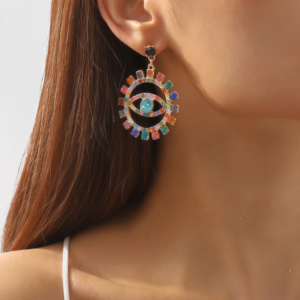 Model wearing Cosmic Energy Diamond Earrings for spiritual protection