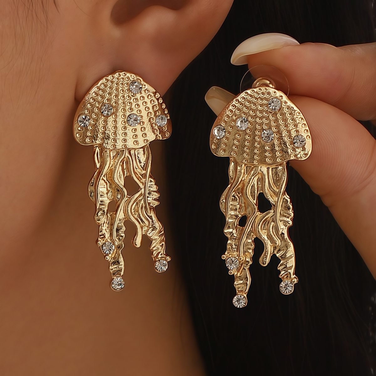 Model wearing Cosmic Energy Jellyfish Earrings