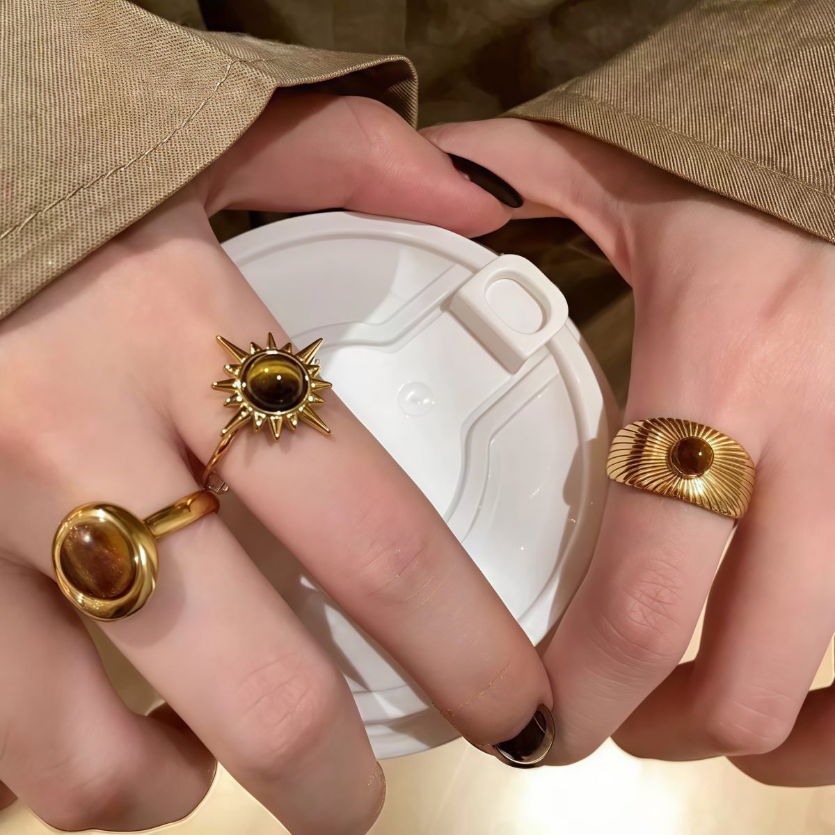 Woman wearing Cosmic Sun Ring – Warm Gold Glow on Finger