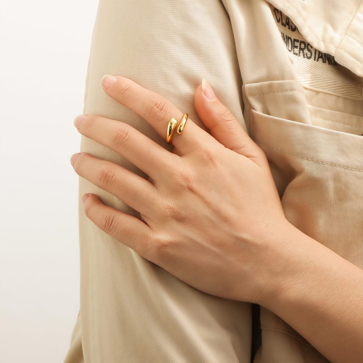 Model wearing the Harmony Drop Ring, showcasing its celestial design and cosmic energy