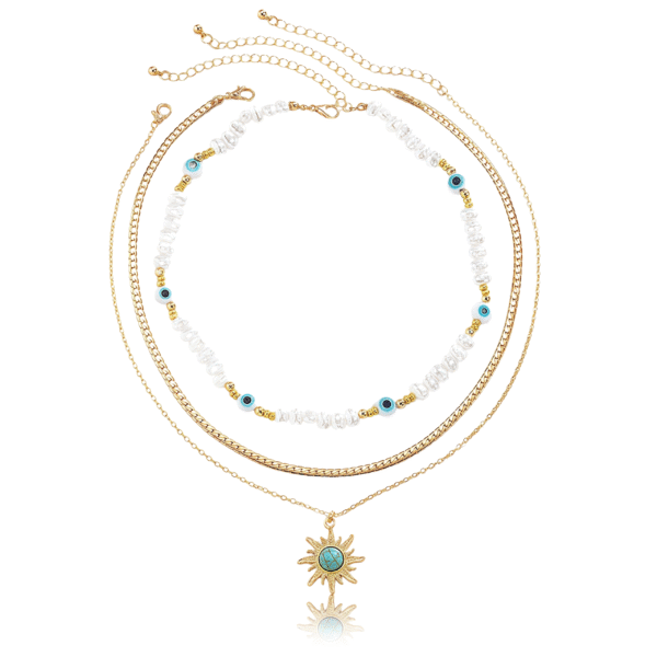 Cosmic Energy pearl and sun trio necklace set on display – layered celestial jewelry