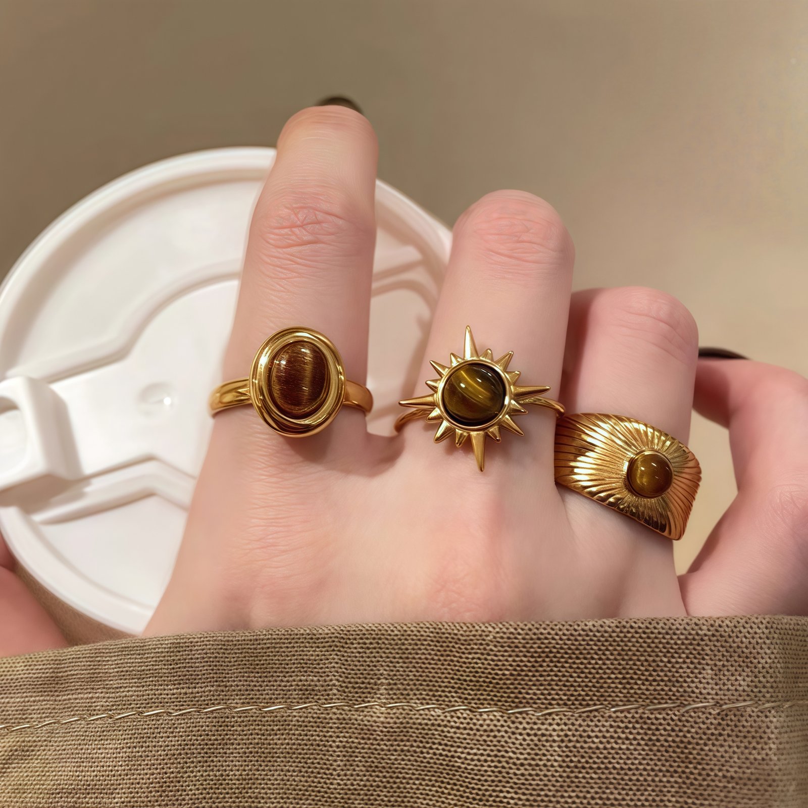 Cosmic Sun Ring – Solar Halo of Light– model Woman wearing Cosmic Sun Ring – Warm Gold Glow on Finger