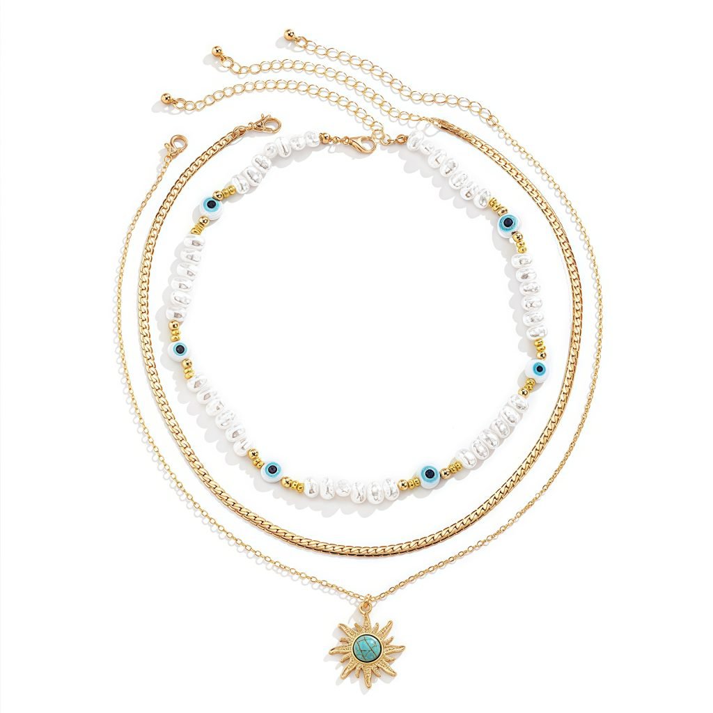 Cosmic Energy pearl and sun trio necklace set on display – layered celestial jewelry