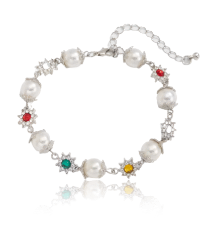 Silver bracelet with luminous pearls and colorful flower charms in red, green, and yellow, symbolizing elegance and positivity.